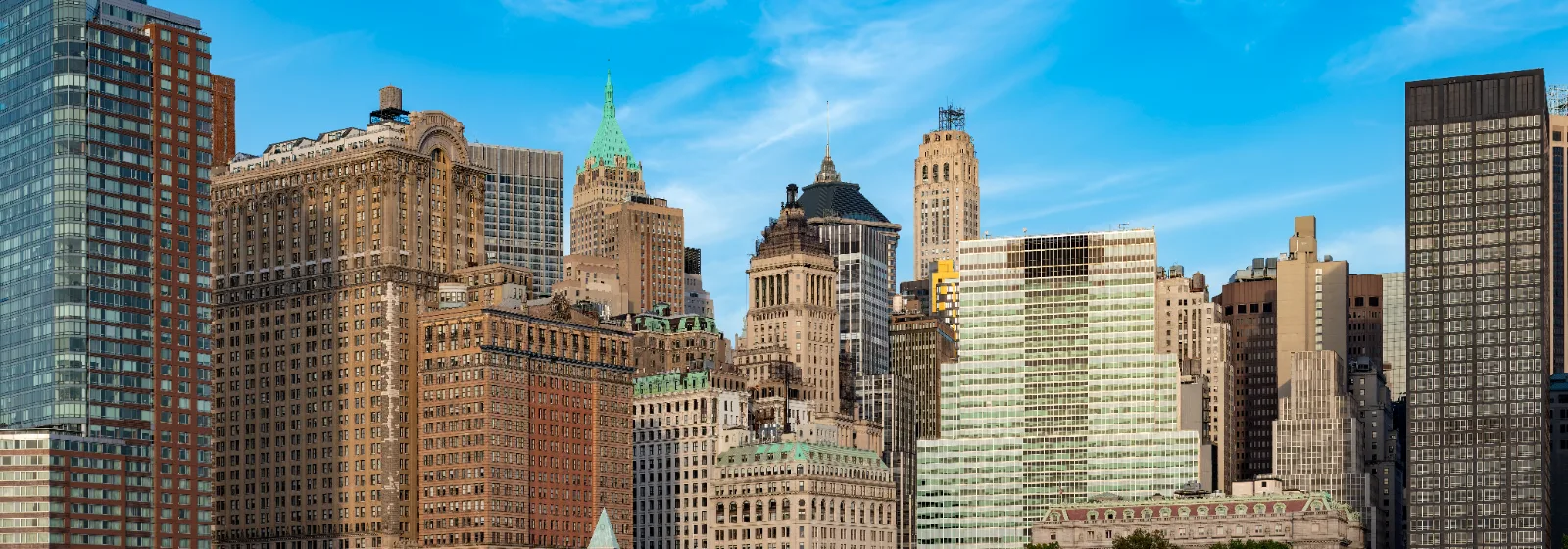 The Lower Manhattan skyline in New York seen from the water on a clear day